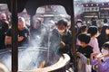 People at a traditional Jokoro at Senso-Ji Temple, Tokyo, Japan