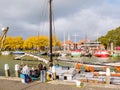 People and traditional sailboat in outer harbour of Enkhuizen, Noord-Holland, Netherlands