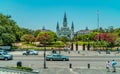 People and traffic on Jackson Square in New Orleans, with St. Louis Cathedral in the background