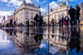 People and traffic in Picadilly Circus in London after the rain. Royalty Free Stock Photo