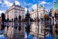 People and traffic in Picadilly Circus in London after the rain. Royalty Free Stock Photo