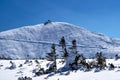 People on the trail and a tourist shelter on the top of Sniezka in the Giant Mountains