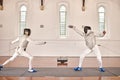 People, training and fighting in fencing competition, duel or combat with martial arts fighter and athlete with a sword Royalty Free Stock Photo