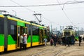 People by a tram