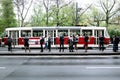 People in a tram station, Prague