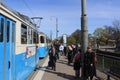 People at the tram stop at Drottningtorget in Gothenburg, Sweden