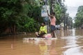 People travel on a raft on a waterlogged road after heavy rainfall, on October 6, 2023 in Guwahati, Assam, India. Severe water log