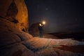 People Travel to scenic destination concept. Tourist man walking holding the light traveling in mountains and enjoy the night sky