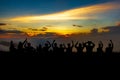 People or traveler sit at cliff and see sunset over the clouds and mountain of forest in silhouette tone at Doi MonJong of Chiangm Royalty Free Stock Photo