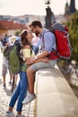 People traveling at vacation and have fun.couple on bridge at Prague kissing