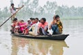 People travelling on a boat during the flood in India