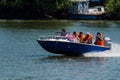 People travelling on the Danube with a boat