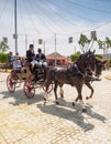 People travelling in a horse drawn carriage at the Seville Fair Royalty Free Stock Photo