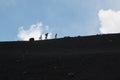 People trekking on Etna volcano, Sicily.