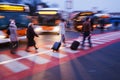 People with trollies at a bus station