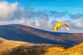 People try paragliding flying with parachutes against clouds Royalty Free Stock Photo