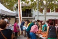 People tying tomatoes together to form the hanging bunches during Tomato `Ramellet` Night Fair Royalty Free Stock Photo