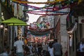 People in typical Lisbon neighborhood decorated for the popular saints