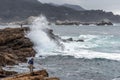 People unaware of dangerous rouge / sleeper wave at Point Lobos Royalty Free Stock Photo