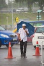 People under monsoon rain in Kuching, Borneo, Malaysia