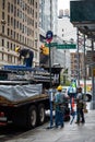 People Unloading Truck with Scaffolds on 5th Avenue, New York