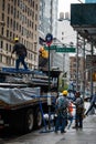 People Unloading Truck with Scaffolds on 5th Avenue, New York