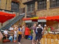 People at urban saturday Farmers Market perusing the fresh and prepared produce Royalty Free Stock Photo