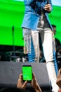 People use mobile phones to live or take pictures at concerts, with bright lights at night. Royalty Free Stock Photo