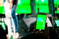 People use mobile phones to live or take pictures at concerts, with bright lights at night. Royalty Free Stock Photo