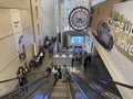 People Using the Escalators at the Auto Show