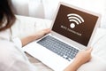 People using laptop connect to Internet using WIFI access point home network system Royalty Free Stock Photo