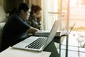 People using laptop working in living room Royalty Free Stock Photo