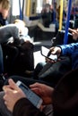 People Using Mobile Phone on London Underground Train