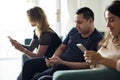 People using mobile phones sitting Royalty Free Stock Photo