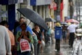 People using rain umbrella in salvador