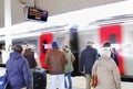 People using train station