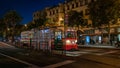 People using tramway for public transport at night, San Francisco