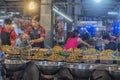 People and a variety of diverse dishes of Thai cuisine on the ni Royalty Free Stock Photo