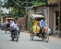 People and vehicles on street in Amritsar, India