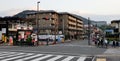 People and vehicles on street in Kyoto, Japan