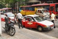 People and vehicles on street in Penang, Malaysia