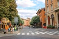 People and vehicles on Via Augusto Righi in Bologna, Italy