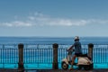 Man on scooter looking down from Terrace in Tropea Royalty Free Stock Photo