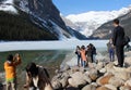 Tourists on rocky shores, Lake Louise, Alberta, Canada Royalty Free Stock Photo