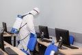 People in virus protective suits and mask disinfecting buildings of coronavirus with the sprayer Royalty Free Stock Photo