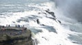 People visit the Gullfoss waterfall