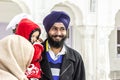 People visit the Harimandir Sahib at the Golden temple complex Royalty Free Stock Photo