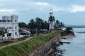 People visit the Lighthouse in Galle Fort in Bay of Galle on southwest coast of Sri Lanka Royalty Free Stock Photo