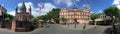 People visit market square in Mainz with famous dome and Gutenberg museum