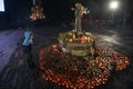 People visit a monument to Holodomor big hunger victims during a commemoration ceremony in Kyiv, Ukraine